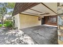 Spacious covered carport, providing ample parking with stone design at 519 Market W Sq, Lakeland, FL 33813