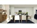 Dining room featuring a modern black table, white chairs, and wood sideboard at 979 Hour Glass Rd, Lakeland, FL 33801