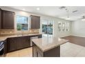 Stylish kitchen showcasing granite countertops, ample cabinet space, and outdoor access at 3848 Spirited Cir, St Cloud, FL 34772