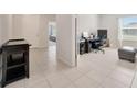 Bright, tiled office space with a large window providing natural light at 1803 Daybreak Dr, Fruitland Park, FL 34731