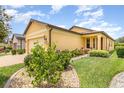 Beautiful exterior view showcasing the home's architectural details and manicured landscaping at 472 Pontevedra Rd, Davenport, FL 33837