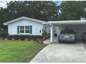 Single story home with a well-maintained yard and covered parking at 730 Barber Cir, Lakeland, FL 33803