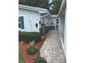 Landscaping featuring flowers and greenery leading up to the house at 730 Barber Cir, Lakeland, FL 33803