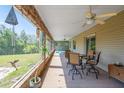 Inviting outdoor patio with a ceiling fan and comfortable seating, perfect for relaxing outdoors at 14365 Evans Ranch Rd, Lakeland, FL 33809
