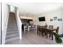Open-concept space with dining area and kitchen, featuring modern finishes and an inviting atmosphere at 3428 Tranquil Trail, Kissimmee, FL 34747