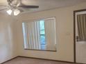 Living room featuring a ceiling fan and natural light at 2220 Woods Trl, Lakeland, FL 33809