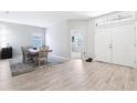 Open dining area featuring wood-look flooring, modern furnishings, and plenty of natural light at 229 St Thomas Dr, Mulberry, FL 33860