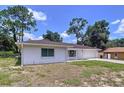 Charming one-story home featuring a brick exterior, well-maintained landscaping and a one car garage at 212 Overlook Dr, Winter Haven, FL 33884