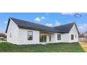 The backyard features a covered patio and a well-maintained lawn at 112 Cr 532B, Bushnell, FL 33513