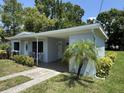 Single story home with carport, and manicured garden beds adding charm and greenery at 705 Grandview Ave, Altamonte Springs, FL 32701