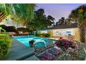 Inviting pool area with a dining set, perfect for outdoor entertaining and enjoying warm evenings at 2110 Reaney Rd, Lakeland, FL 33803
