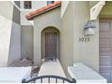 Inviting townhome entrance with stylish front door, exterior light, and well-kept exterior at 5935 Tivoli Gardens Blvd, Orlando, FL 32829