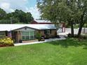 Delightful single-story home highlighting a charming front facade and lush lawn at 1423 Spruce N Rd, Lakeland, FL 33809