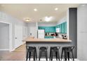 Efficient kitchen boasts a breakfast bar with seating and ample cabinet space at 3175 Feltrim Pl # 405, Kissimmee, FL 34747