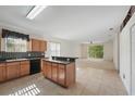 The kitchen connects seamlessly to the living area, promoting a functional and sociable living space at 442 Graystone Blvd, Davenport, FL 33837