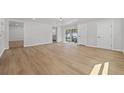 Bright living room featuring hardwood flooring and large windows for natural light at 2800 E Anderson St, Orlando, FL 32803