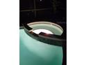 Inviting hot tub with integrated lighting for relaxing evenings at 189 Minniehaha Cir, Haines City, FL 33844