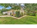 Charming single-story home with lush landscaping at 454 San Jose Dr, Winter Haven, FL 33884