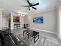 Comfortable living room featuring modern flooring, neutral paint, and an open layout at 202 E South St # 5050, Orlando, FL 32801