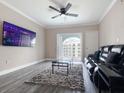 Bright living room with balcony access offering community views and contemporary furnishings at 202 E South St # 5050, Orlando, FL 32801