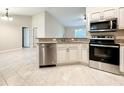 Well-equipped kitchen featuring stainless steel appliances, granite countertops and ample storage space at 4887 Sw 159Th Lane Rd, Ocala, FL 34473