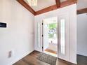 Bright entryway featuring hardwood floors, a charming welcome mat, and a view to the front yard at 4102 Stonehenge Rd, Mulberry, FL 33860