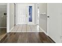 Inviting entryway featuring tile flooring and a white front door with glass inserts at 6125 Morningdale Ave, Lakeland, FL 33813