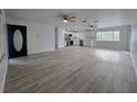 Spacious living area featuring wood-look floors and abundant natural light at 17 Oak Loop, Ocala, FL 34472