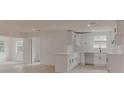 Modern kitchen features white cabinets, an island, and ample counter space, creating a clean and functional cooking area at 1255 Pine St, Altamonte Springs, FL 32701