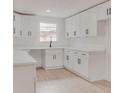 Bright kitchen showcases sleek white cabinets, modern hardware, and a functional layout perfect for cooking at 1255 Pine St, Altamonte Springs, FL 32701