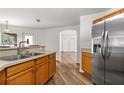 Galley style kitchen with stainless steel appliances and wood cabinets at 9700 Sw 196 Circle, Dunnellon, FL 34432