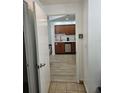 Efficient kitchenette featuring wooden cabinets and modern appliances at 7601 Canada Ave # 220, Orlando, FL 32819