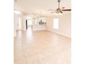 Bright living room with tile flooring, ceiling fan, and an open floor plan at 1510 Avleigh Cir, Orlando, FL 32824