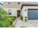 Charming front entrance featuring rock accents, lush landscaping and a welcoming porch at 5660 Keaton Springs Dr, Lakeland, FL 33811