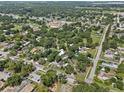 Expansive aerial view of the home nestled in a lush, green neighborhood at 306 Avenue A E, Winter Haven, FL 33880