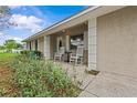 Inviting front porch with rocking chairs, enhancing the home's curb appeal and providing a welcoming space at 4003 Prairie Bend Ln, Lakeland, FL 33812