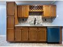 Well-lit kitchen area with stainless steel sink and sleek black faucet, set against a decorative backsplash at 1238 Honeytree E Ln, Lakeland, FL 33801