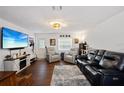 Spacious living room with modern furnishings, sleek leather seating, and lots of natural light at 3983 Shay Dr, Bartow, FL 33830