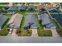 Aerial view of a home with well-maintained lawn and a privacy-fenced backyard at 2576 Boots Rd, Lakeland, FL 33810