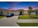 Charming single-story home featuring a well-manicured lawn, and a freshly painted, welcoming facade at 3628 Diving Dove Ln, Bartow, FL 33830