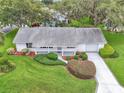 Inviting single-Gathering home with lush lawn, mature trees and well-maintained landscaping at 5402 Rosewall Cir, Leesburg, FL 34748
