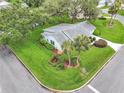 Lush landscaping surrounds this well-maintained home with a charming curb appeal on a corner lot at 5402 Rosewall Cir, Leesburg, FL 34748
