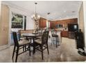 Modern kitchen with stainless steel appliances and a breakfast nook at 310 Stakes Ct, Deland, FL 32724