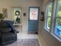 Inviting living room with bright, white walls and hardwood floors at 734 Maryland Ave, Winter Park, FL 32789
