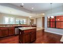 Well-appointed kitchen with granite countertops, hardwood floors, and stainless-steel appliances at 154 Indian Wells Ave, Kissimmee, FL 34759