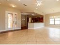 Open floor plan with tile flooring, and lots of light through the double doors and windows at 154 Indian Wells Ave, Kissimmee, FL 34759