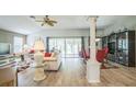 Spacious living area with an open layout, dining space, and hardwood floors at 17567 Se 81St Parnassus Ct, The Villages, FL 32162
