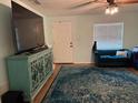 Bright living room with a blue accent rug and a comfortable sofa at 3439 Swindell Rd, Lakeland, FL 33810