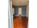 Inviting living room with wood floors and natural light at 5418 Brownell St, Orlando, FL 32810