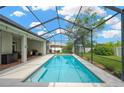 Relaxing screened-in pool area with a spacious patio, perfect for outdoor entertaining and enjoying sunny days at 2973 Blackwater Creek Dr, Lakeland, FL 33810